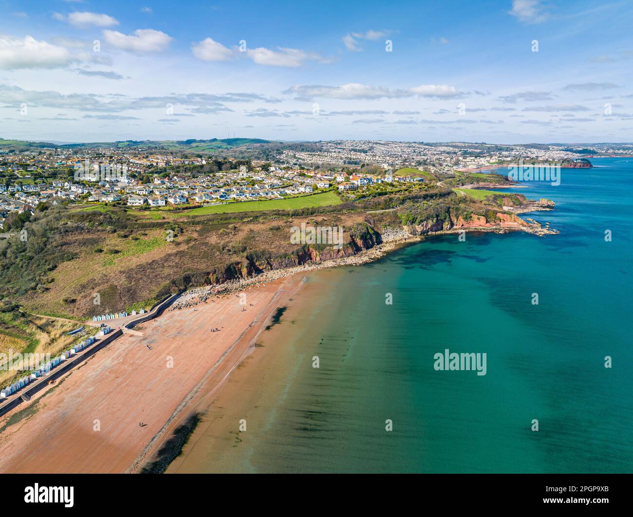 Aerial view of Armchair Cove and Broadsands Beach from a drone