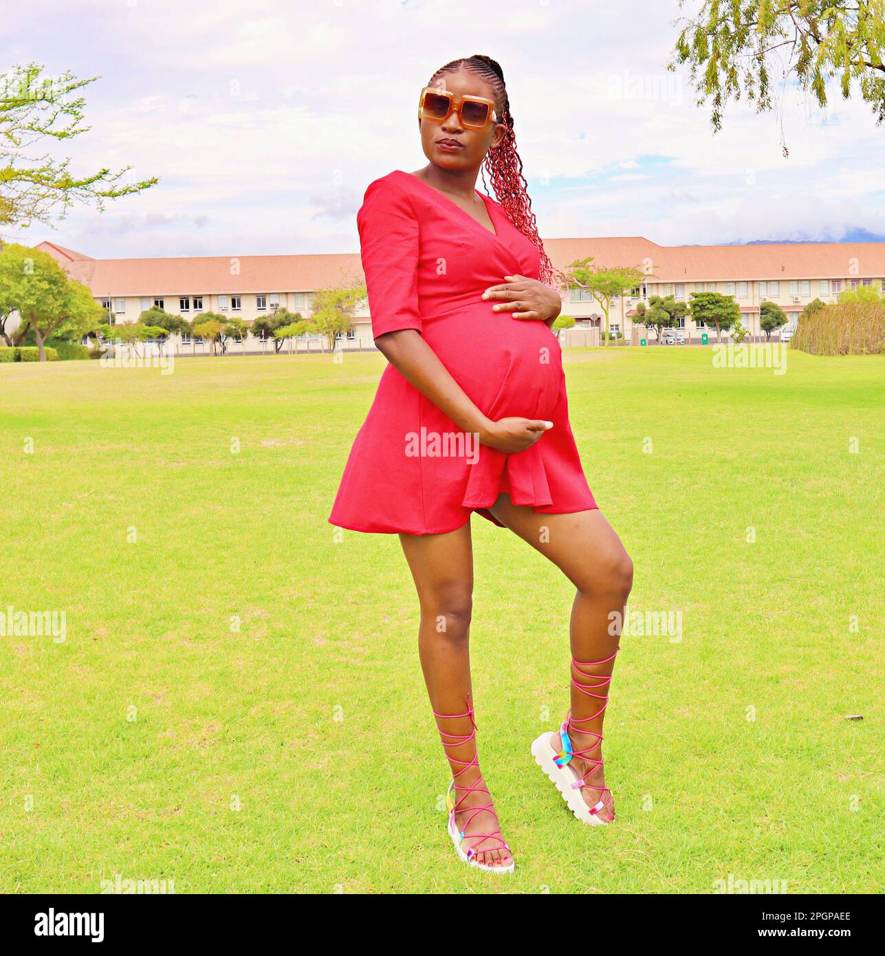 Pregnant woman wearing red hi-res stock photography and images - Alamy