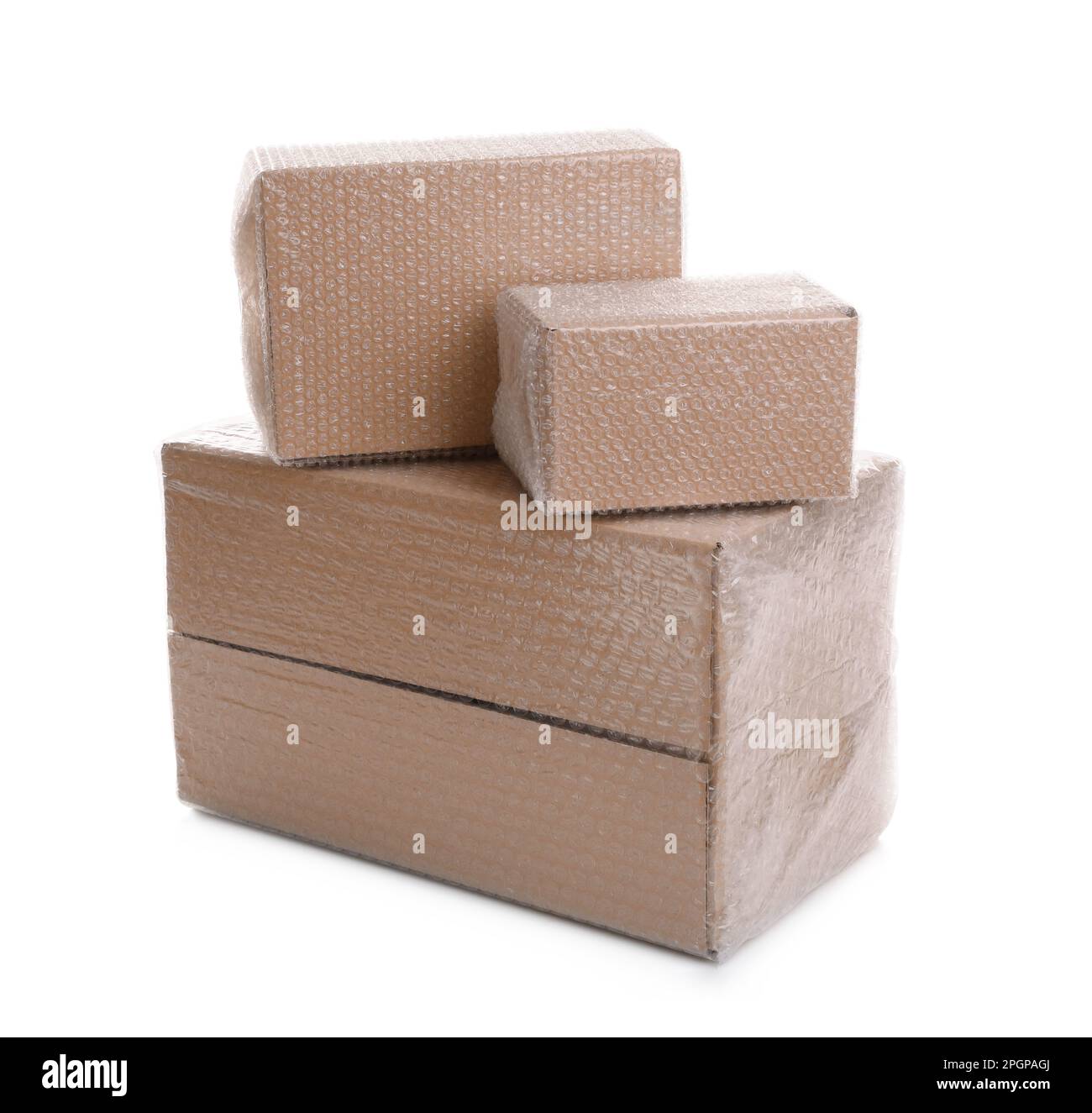 Cardboard boxes packed in bubble wrap on white background Stock Photo