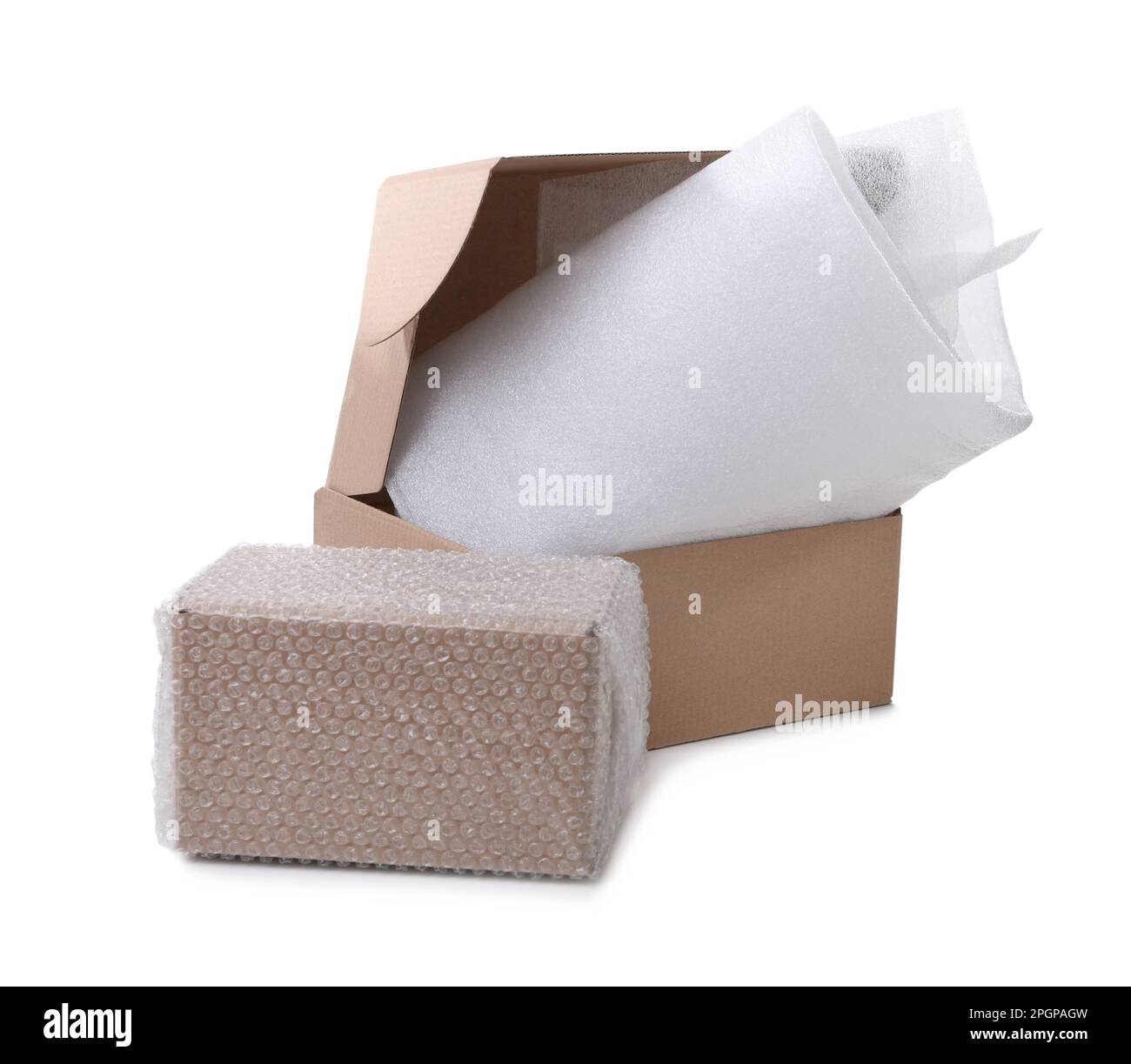 Cardboard boxes with bubble wrap and packaging foam on white background