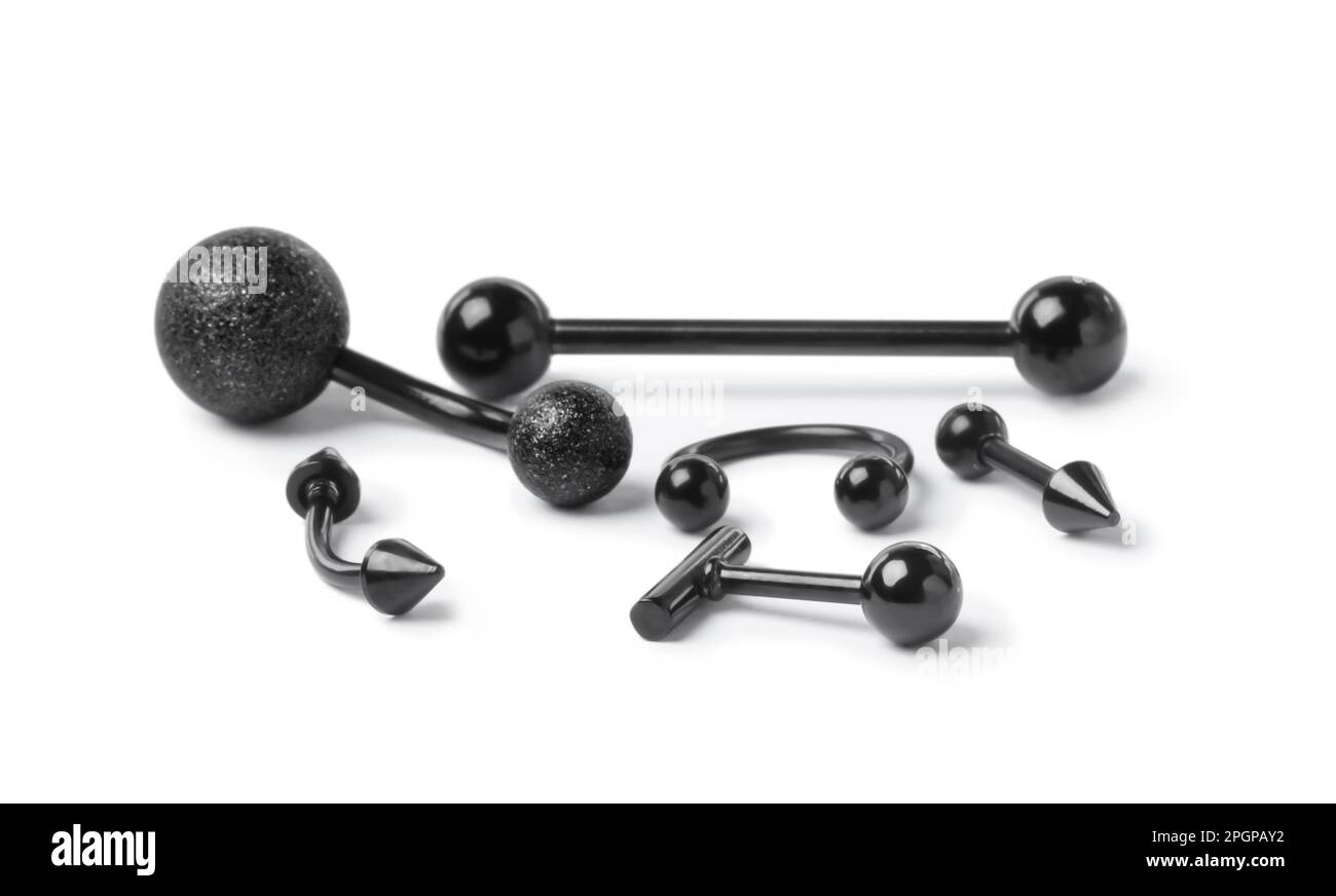 Stylish black piercing jewelry on white background Stock Photo Alamy