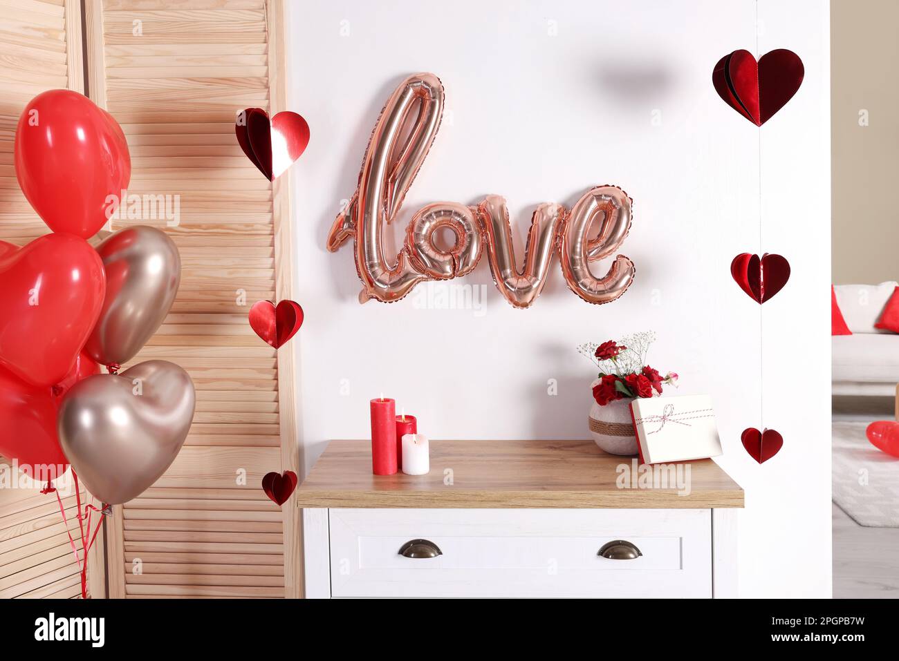 Cozy room decorated for Valentine's Day with heart shaped balloons