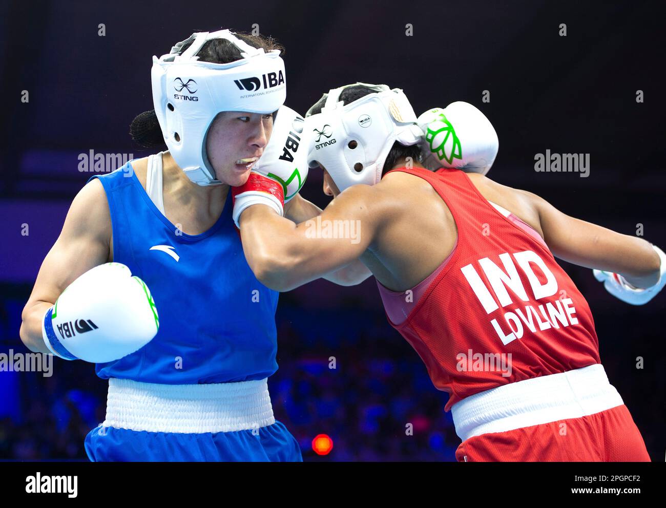 Li Quan Boxing New Delhi, India. 23rd Mar, 2023. China's Li Qian (L) competes with ...
