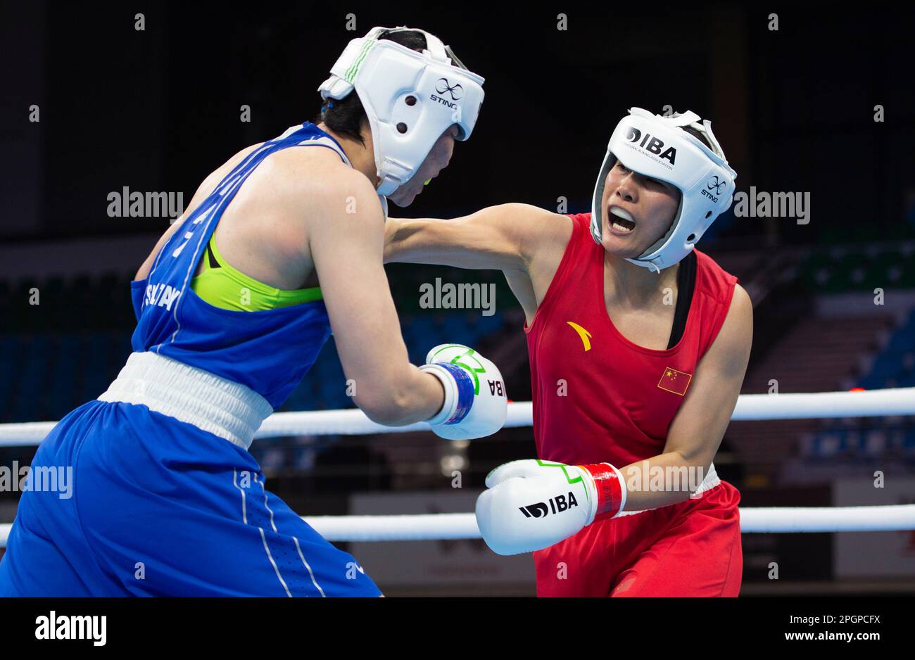 New Delhi, India. 23rd Mar, 2023. China's Wang Lina (R) competes with ...