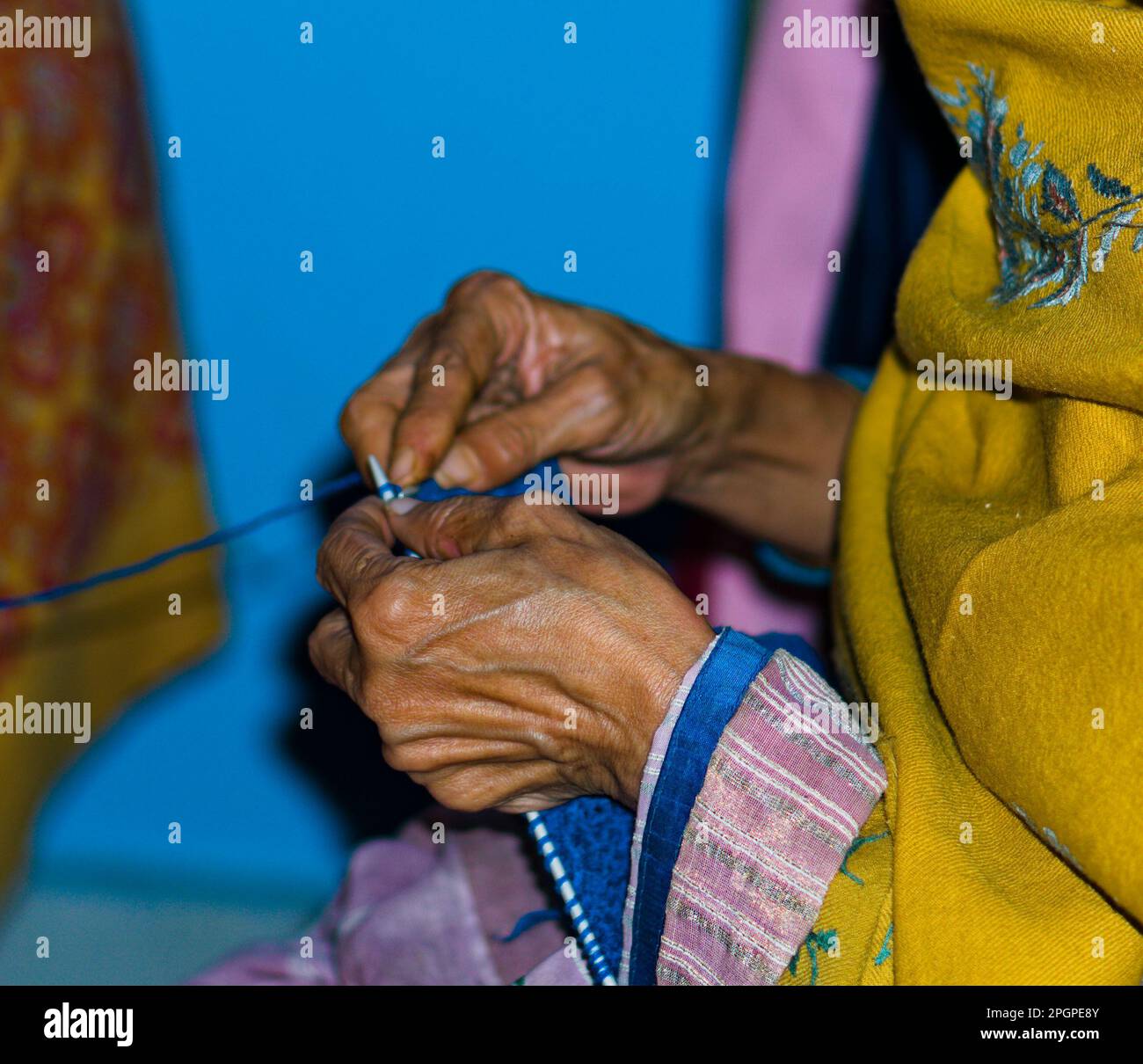 an old woman knitting wool in india Stock Photo Alamy