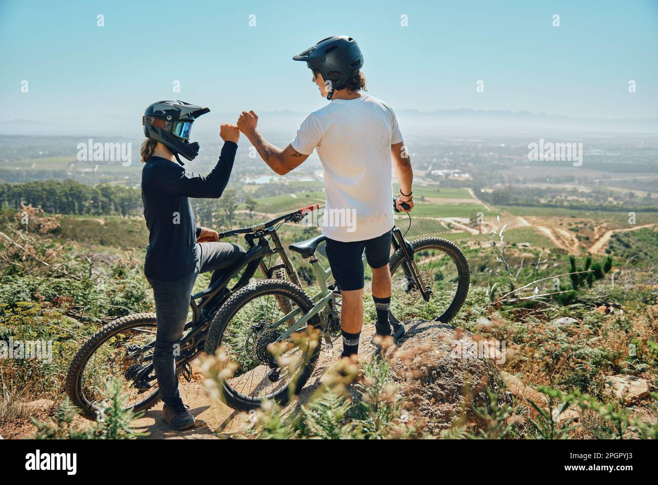 Fist bump, teamwork and cycling with friends on mountain bike for  motivation, extreme sports and adventure. Fitness, workout and bonding with  men in Stock Photo - Alamy
