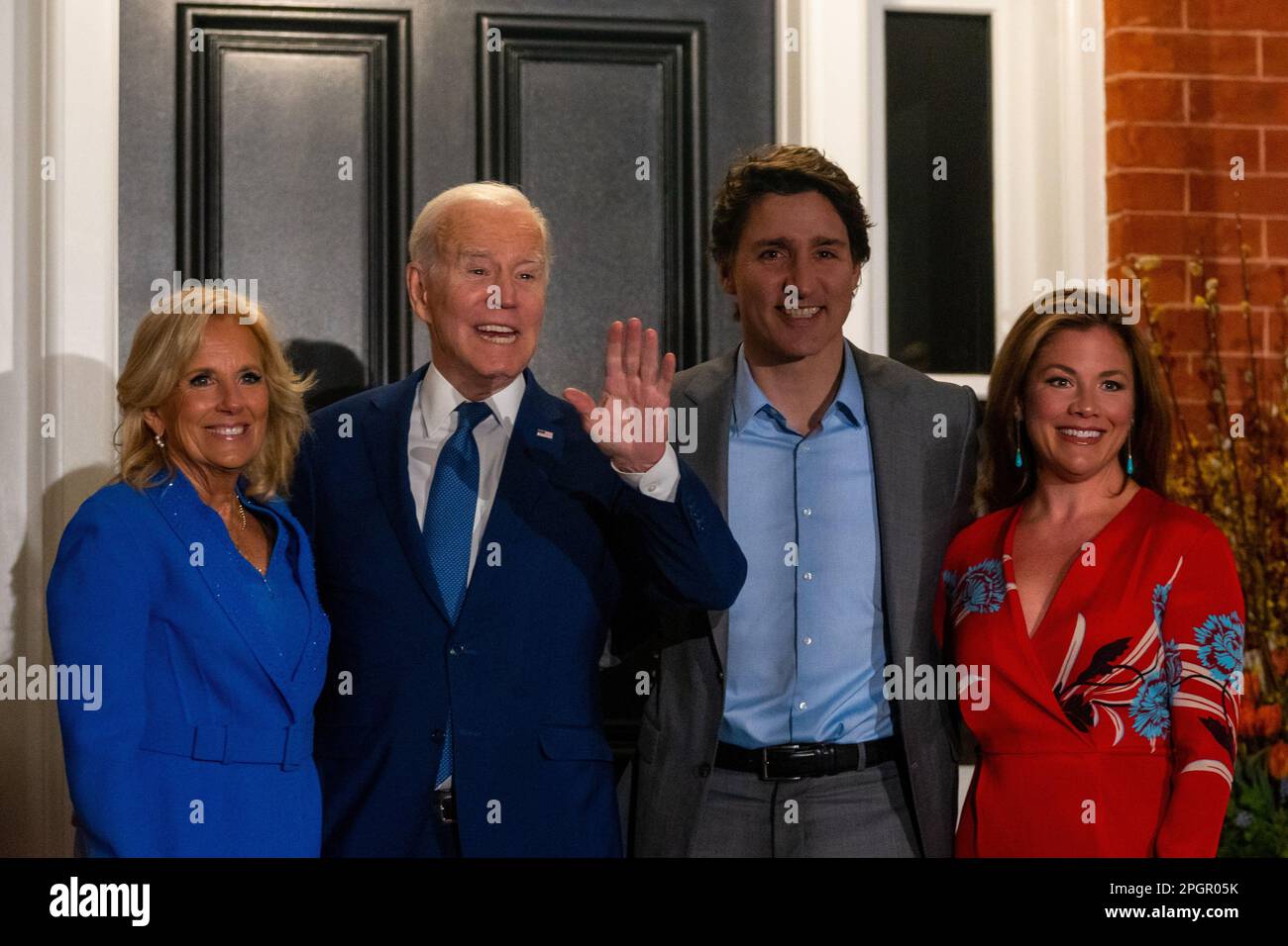 U.S. President Joe Biden (L2) holds up his hand as he poses for a photo with U.S. First Lady Jill Biden (L), Canadian Prime Minister Justin Trudeau (R2), and Canadian First Lady Sophie Grégoire Trudeau (R) during his first official visit to the country since he became president, outside of Rideau Cottage in Ottawa. Though visits from American presidents to Canada typically take place soon after election, Biden's inaugural visit to the northern neighbour has been delayed due to COVID-19 travel restrictions. (Photo by Katherine Cheng/SOPA Images/Sipa USA) Stock Photo