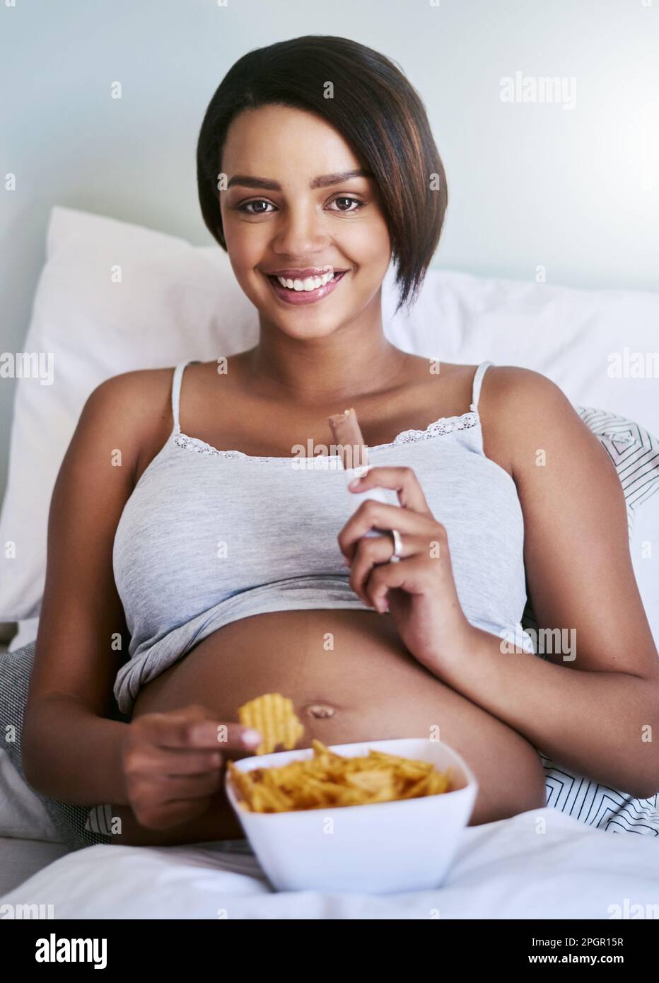 Im pregnant, whats your excuse. a pregnant woman enjoying a chocolate