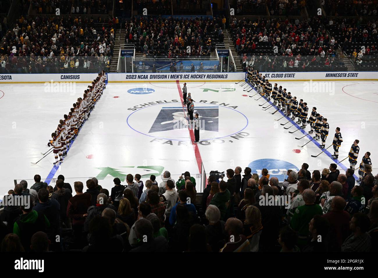 Fargo, ND on Thursday, March 23, 2023. Teams line up for the National Anthem ahead of a game at the West Regional of the NCAA men's hockey tournament between the Canisius College Golden Griffins and the University of Minnesota Golden Gophers at Scheels Arena in Fargo, ND on Thursday, March 23, 2023. Minnesota won 9-2. By Russell Hons/CSM Stock Photo