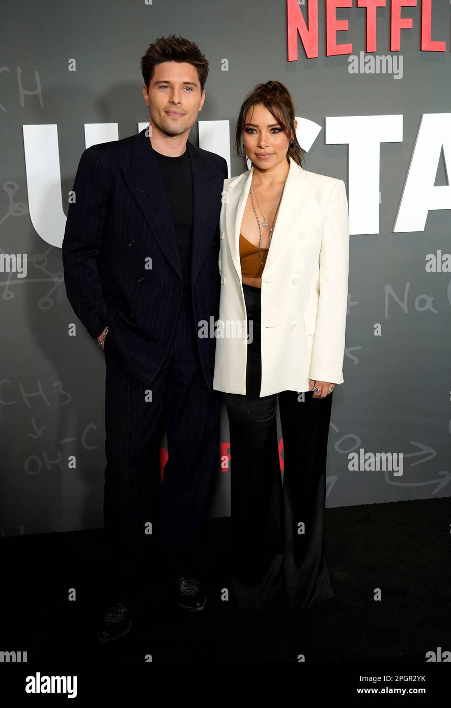Ronen Rubinstein, left, and his wife Jessica Parker Kennedy pose at the