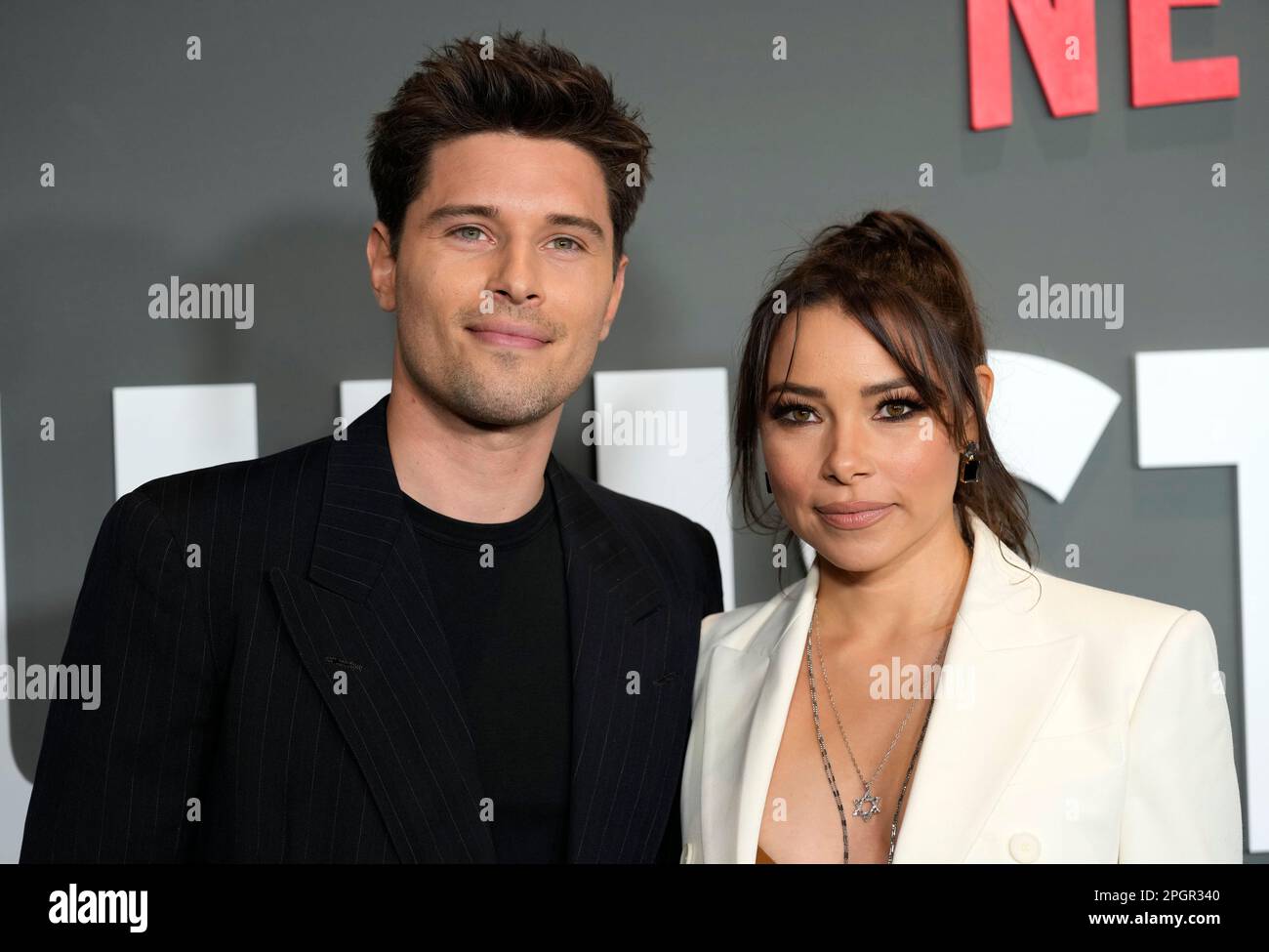 Ronen Rubinstein, left, and his wife Jessica Parker Kennedy pose at the
