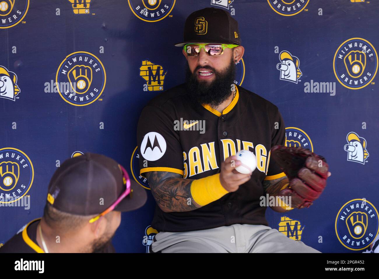San Diego Padres' Rougned Odor talks to teammates in the dugout prior to a  spring training baseball game against the Milwaukee Brewers Thursday, March  23, 2023, in Phoenix. (AP Photo/Ross D. Franklin
