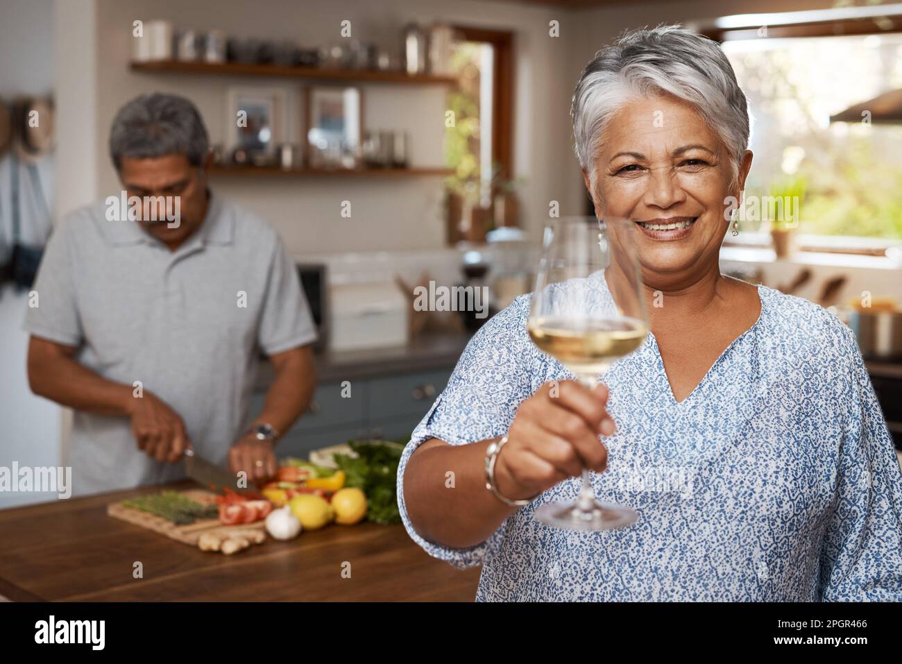 Heres to the happy life. Portrait of a happy mature woman enjoying a ...