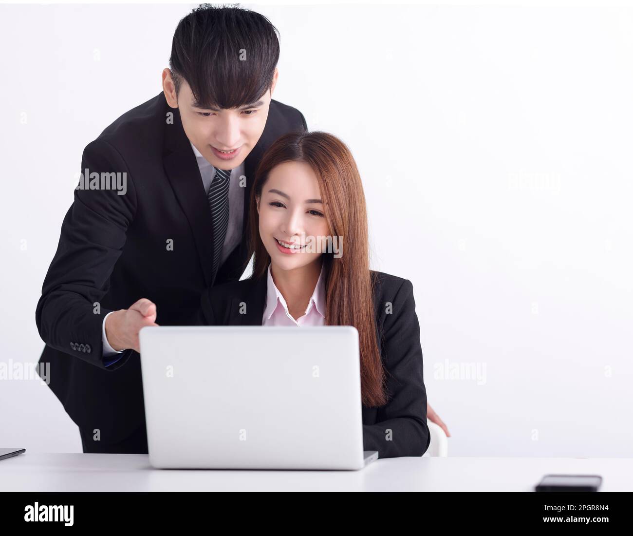 Business  team using laptop and working together in office Stock Photo