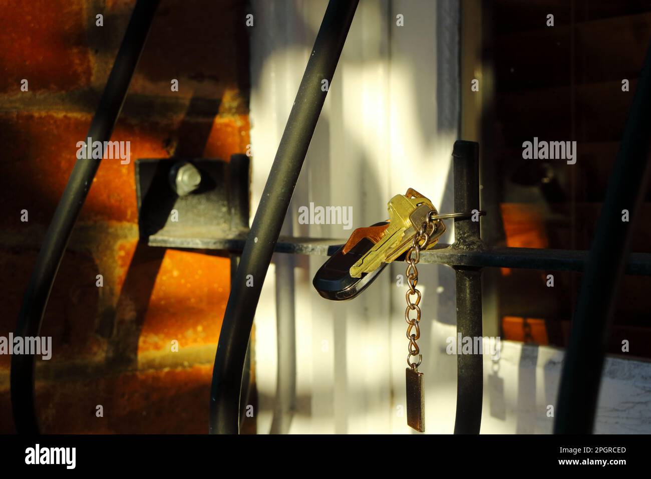Lost keys was dangling from metal window bars Stock Photo