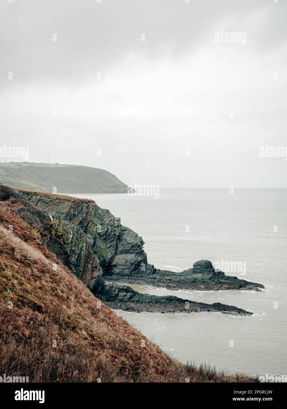 Clouds and rain over the ocean along the Welsh coastal path and coastline. Stock Photo