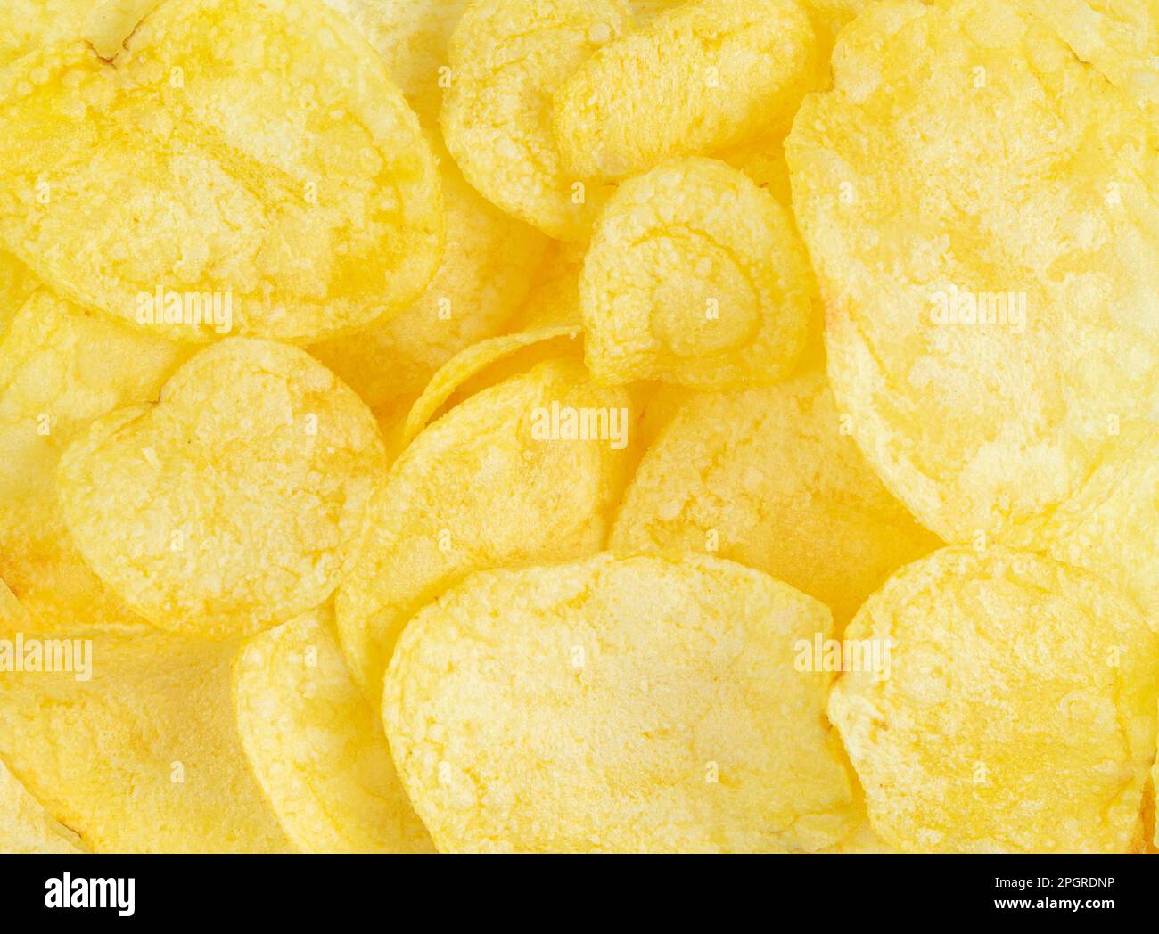 Crispy potato chips texture or background. Close up Stock Photo