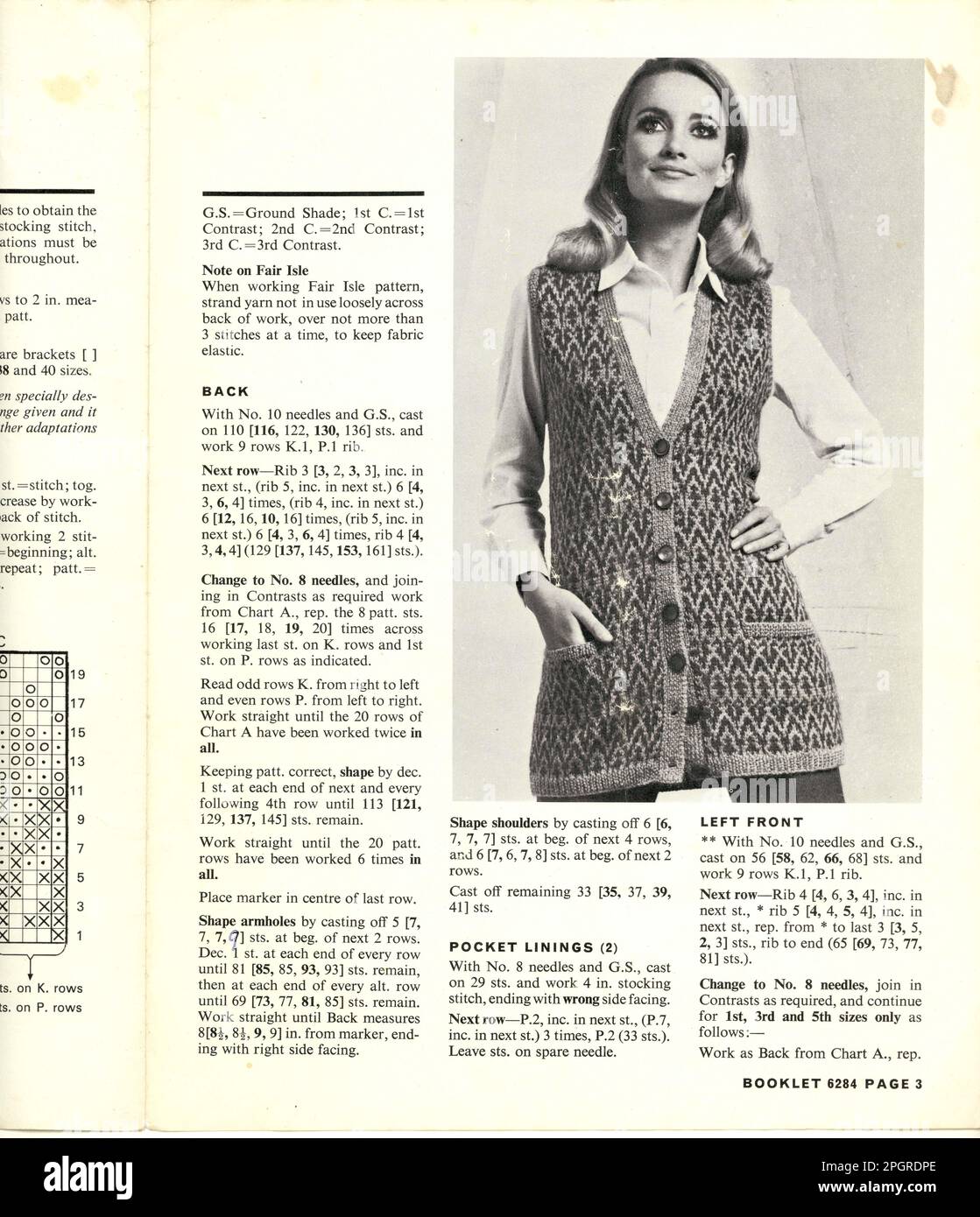 Original example of Paton's retro knitting pattern from the late 1970's, the model is wearing a long hand knitted Fairisle syle button down cardigan, U.K. circa 1979 Stock Photo