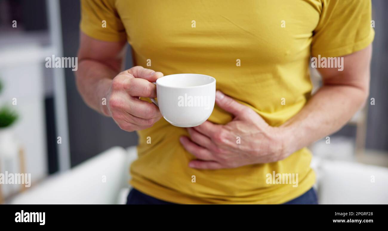 Coffee Stomach Ache. Digesting Acid Pain And Health Risk Stock Photo Alamy