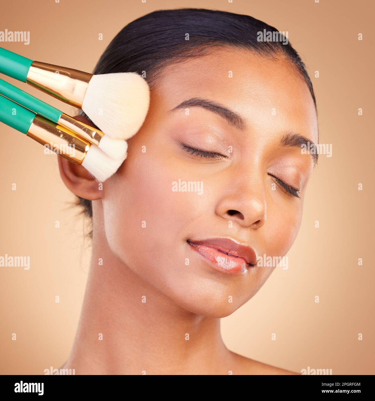 Makeup, relax and brush with indian woman in studio for foundation