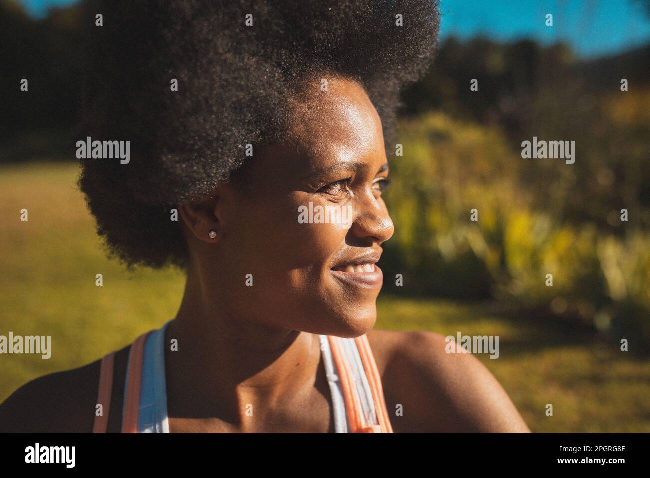 Portrait of african american woman looking ahead and smiling Stock Photo