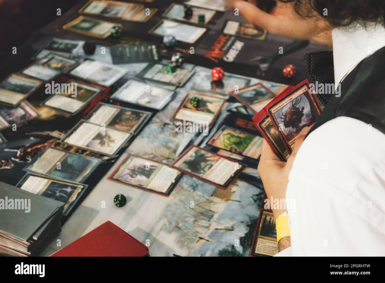 A group of people playing Magic The Gathering roleplaying collectible