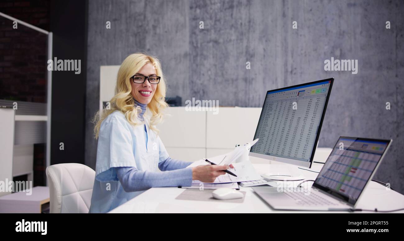 Account Manager In Office Coding Medical Bill Stock Photo