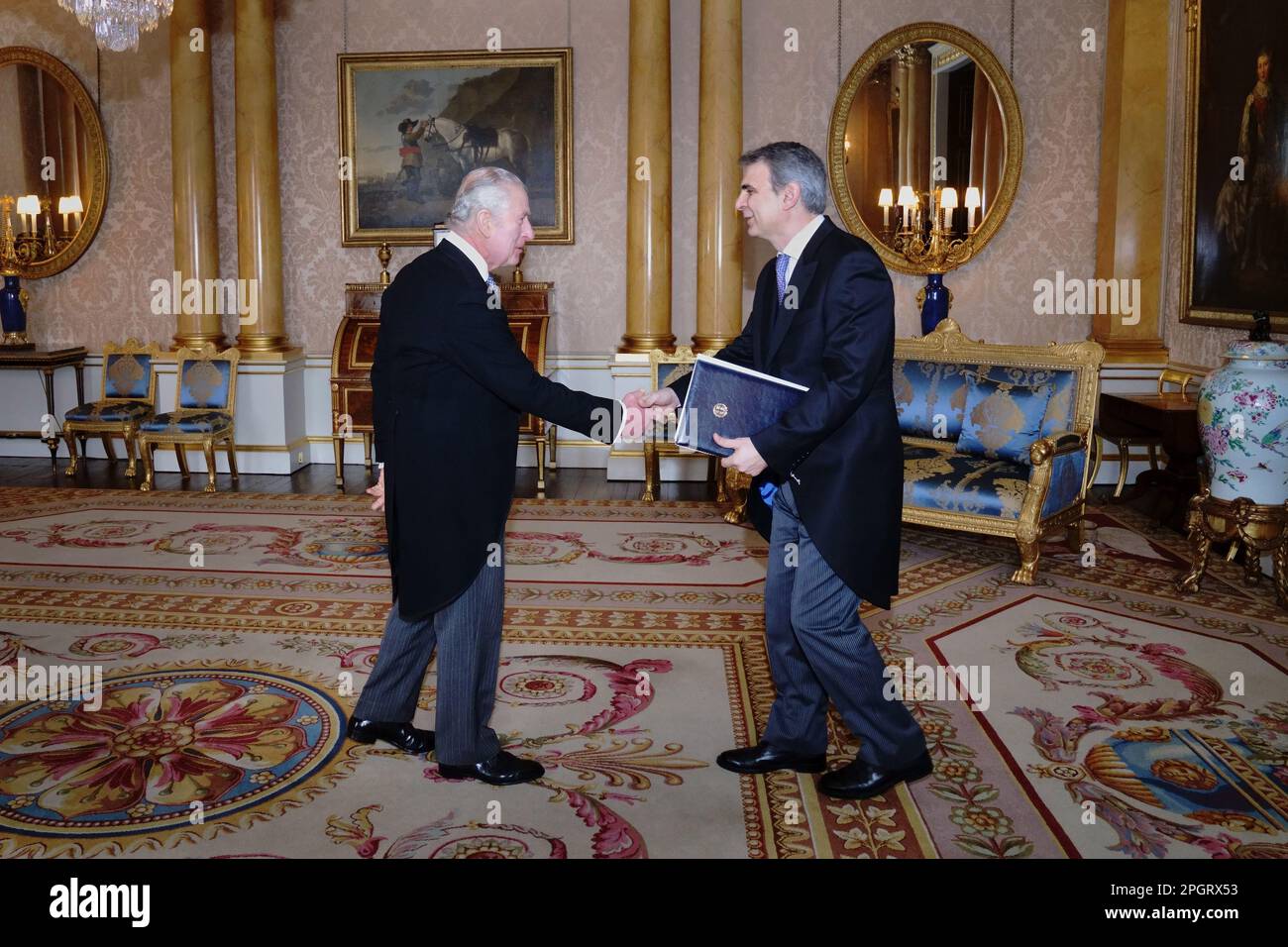 RETRANSMITTING CORRECTING NAME OF AMBASSADOR King Charles III receives the Ambassador of Greece, Yannis Tsaousis, as he presents his credentials during a private audience at Buckingham Palace, London. Picture date: Thursday March 2, 2023. Stock Photo