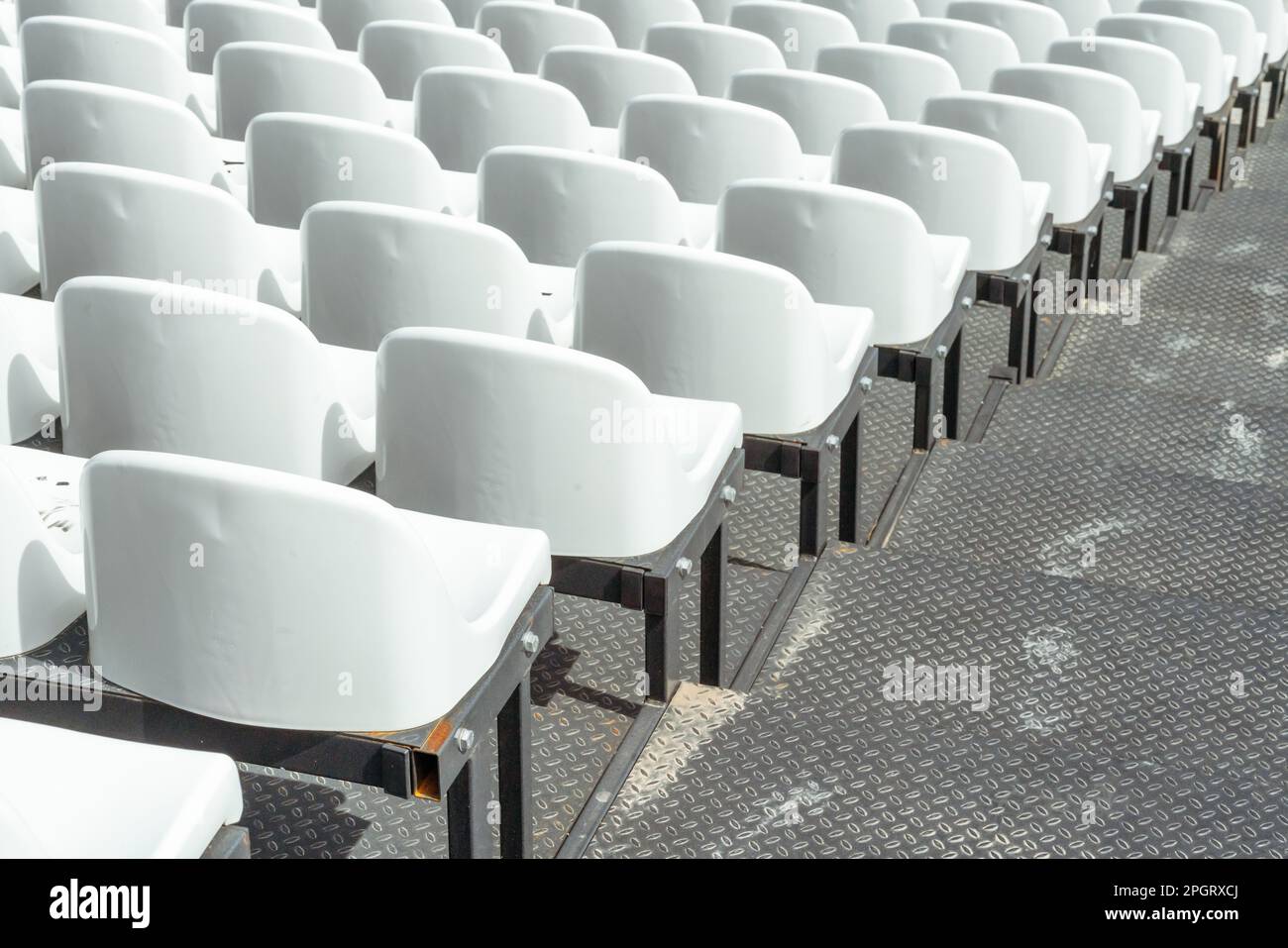 Tribune sports stadium with empty chairs Stock Photo - Alamy