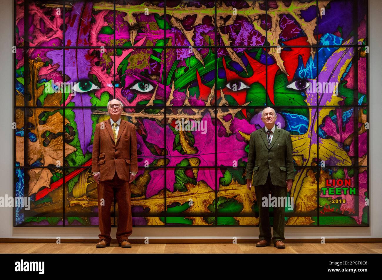 London, UK.  24 March 2023.  Artists Gilbert & George, in front of 'Lion Teeth', 2019, at the opening of The Gilbert & George Centre near Brick Lane in East London.  It is a new permanent venue for visitors to experience their artworks with the inaugural exhibition being The Paradisical Pictures, exhibited in London for the first time, and runs to 12 April.  Credit: Stephen Chung / Alamy Live News Stock Photo