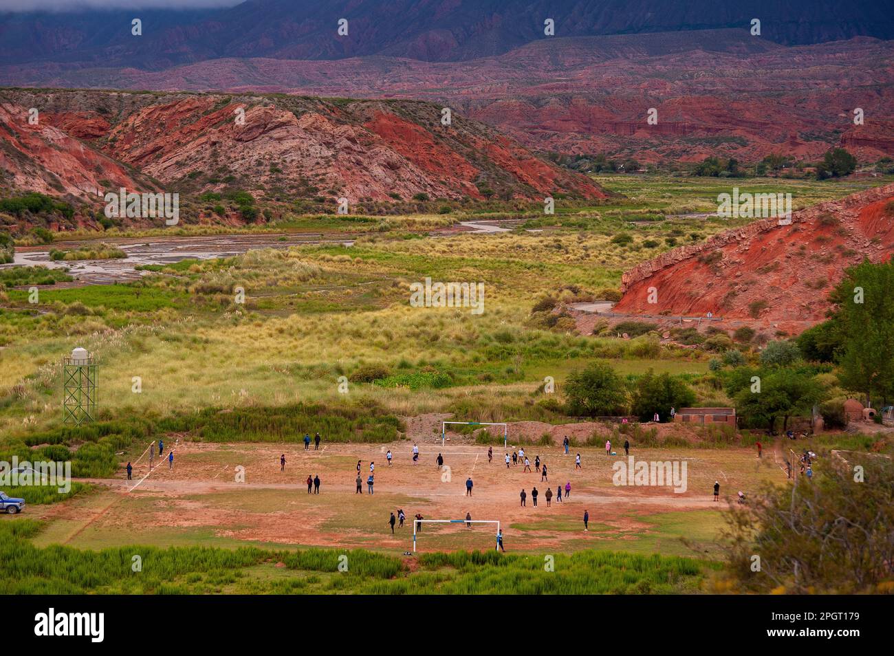 Students trainning football at the football field Nehuen Iglesias, Pueblo Viejo village near La Poma, on the Ruta 40, Salta Province, Argentina Stock Photo
