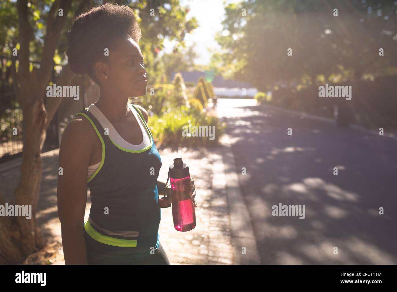 Black woman running outdoors hi-res stock photography and images - Alamy