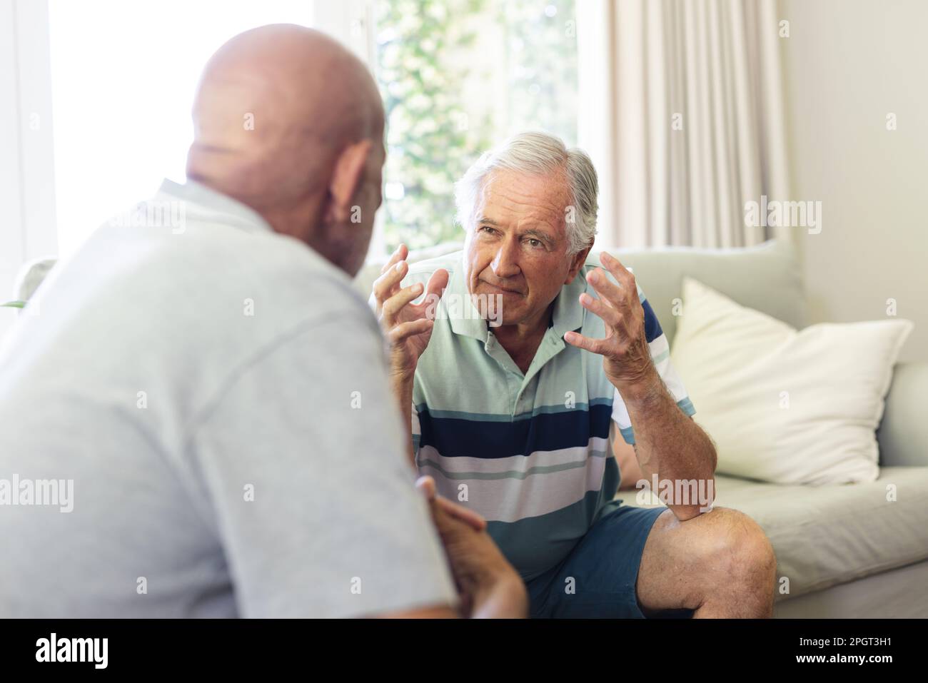 Two diverse male friends hi-res stock photography and images - Alamy