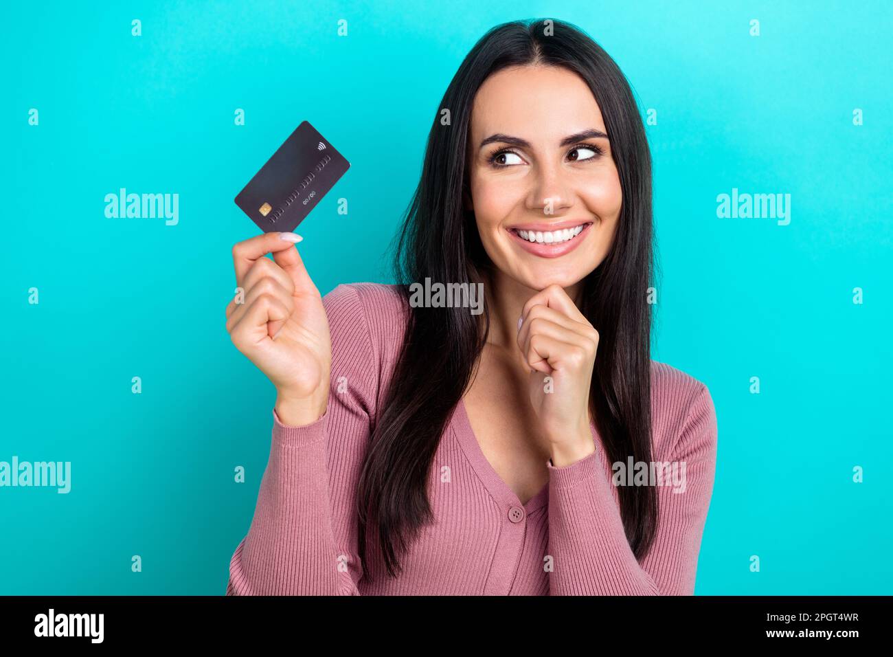 Portrait photo of young promoter optimistic woman smile visa mastercard debit card new terms high percent cashback isolated on blue color background Stock Photo
