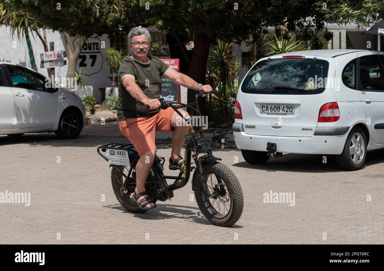 Western Cape, South Africa. 2023. Man riding an electric bike, taking a test drive. Stock Photo