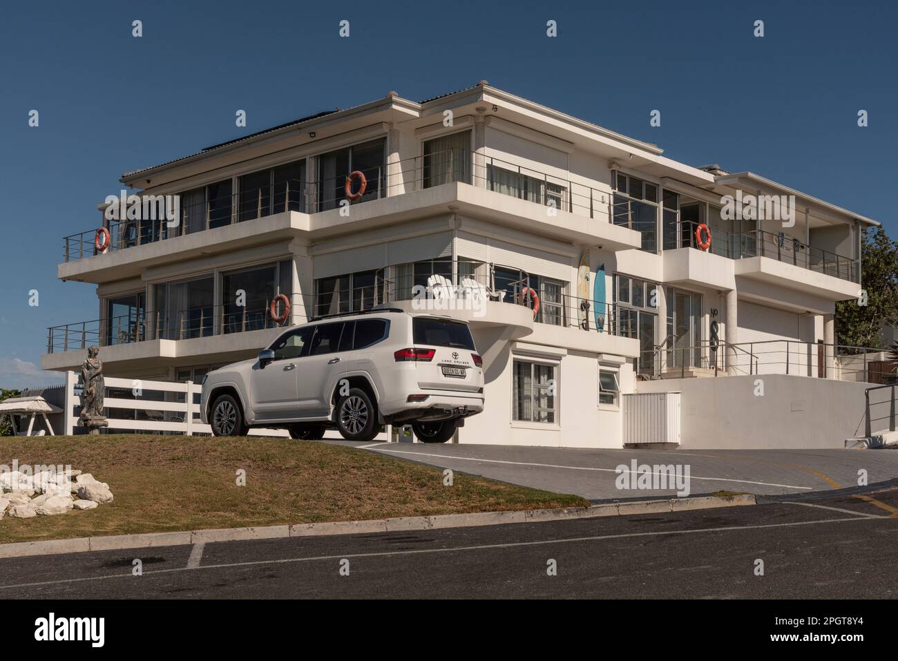 Yzerfontein, West Coast, South Africa. 2023. Modern housing on the west coast of South Africa with a white 4x4 car on the driveway. Stock Photo