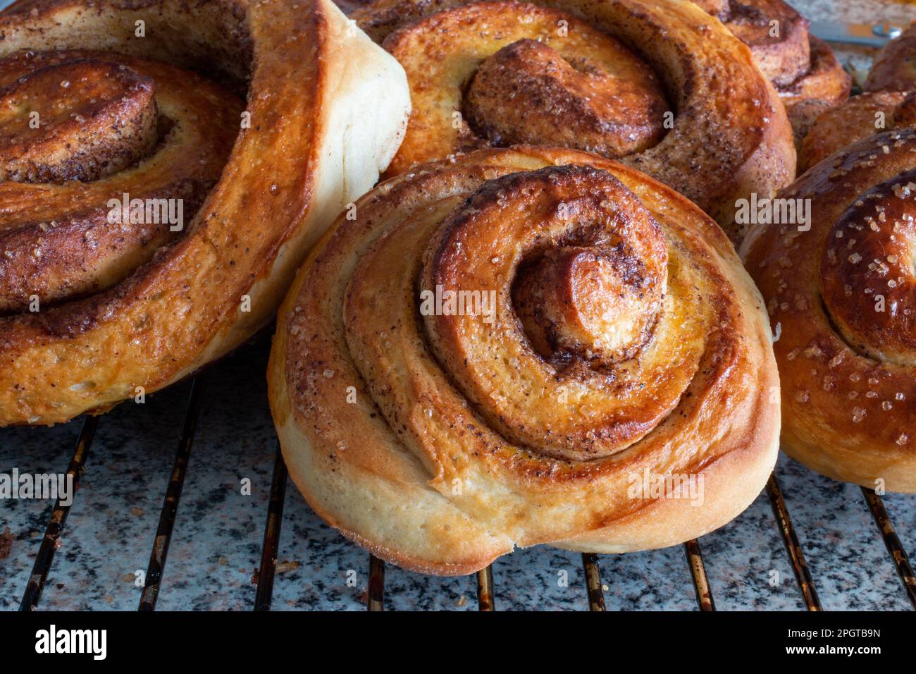 stack of homemade cinnamon buns decorated with granulated sugar Stock Photo