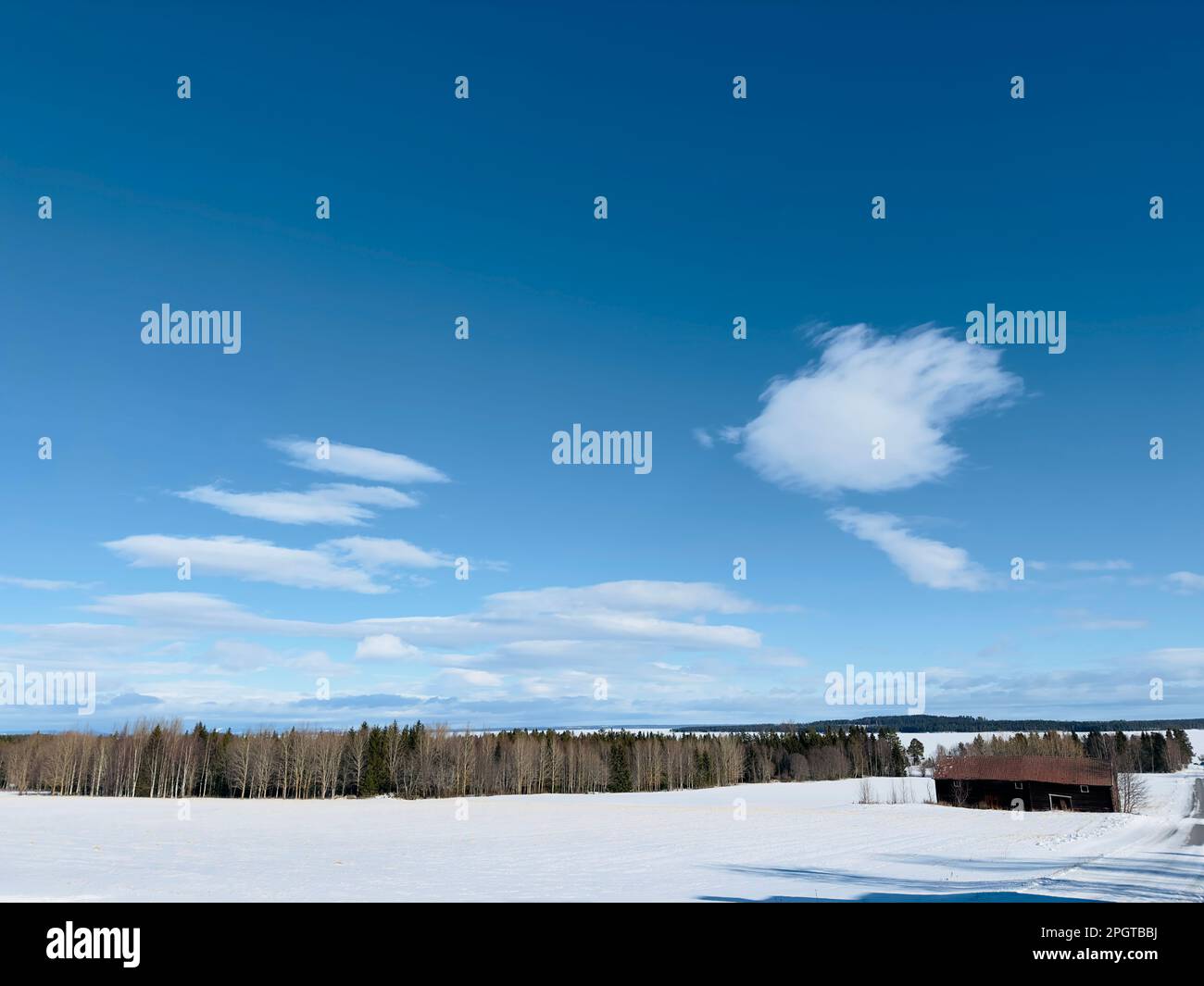 Winter landscape of frozen lake in north Sweden Stock Photo