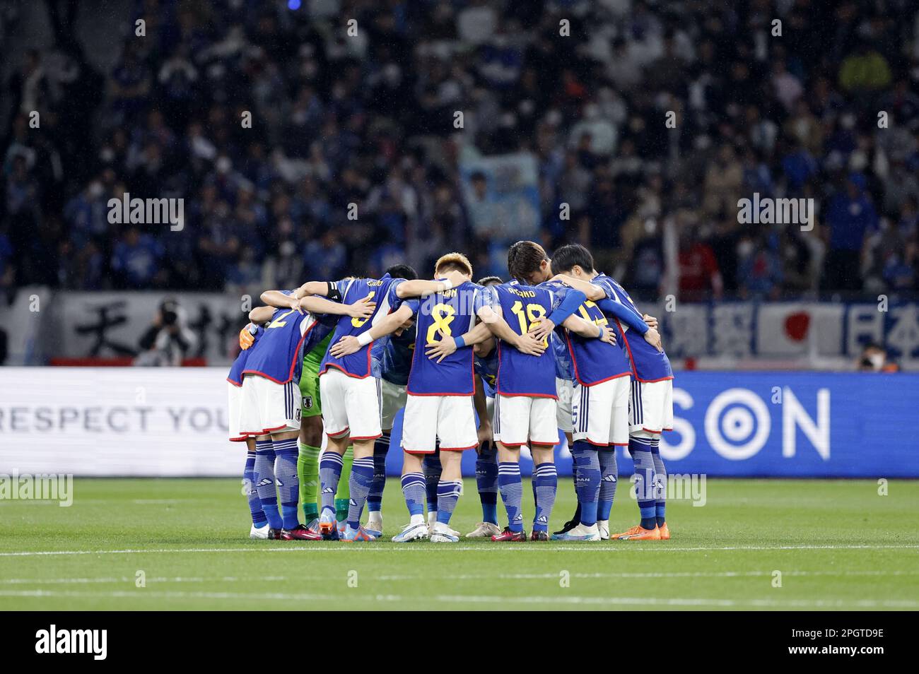 Tokyo, Japan, March 24, 2023. Japan players huddle on the pitch ahead