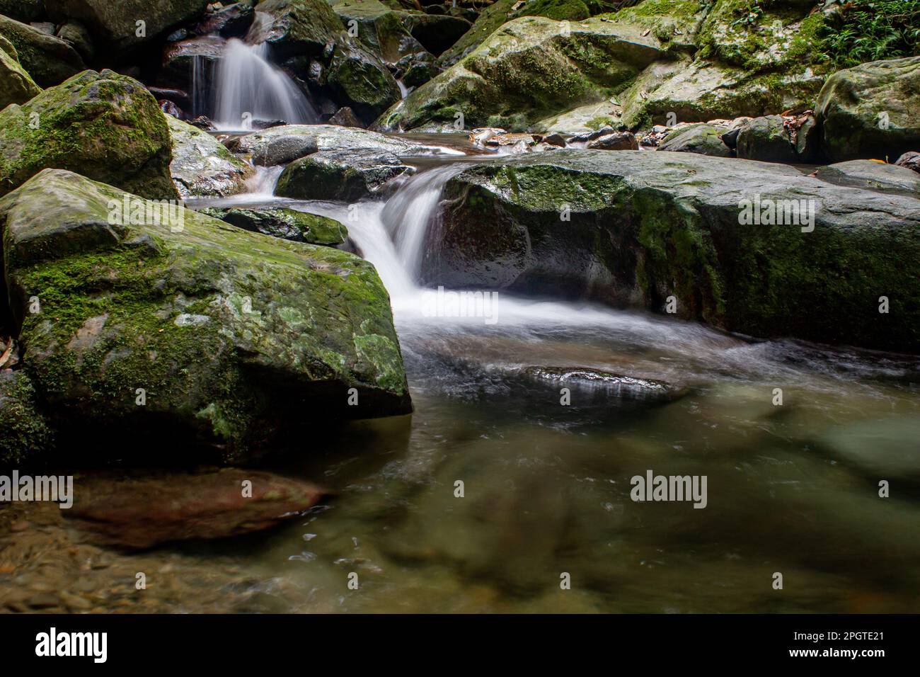 Scenic view of water flowing from the Kipungit Waterfall near Poring ...