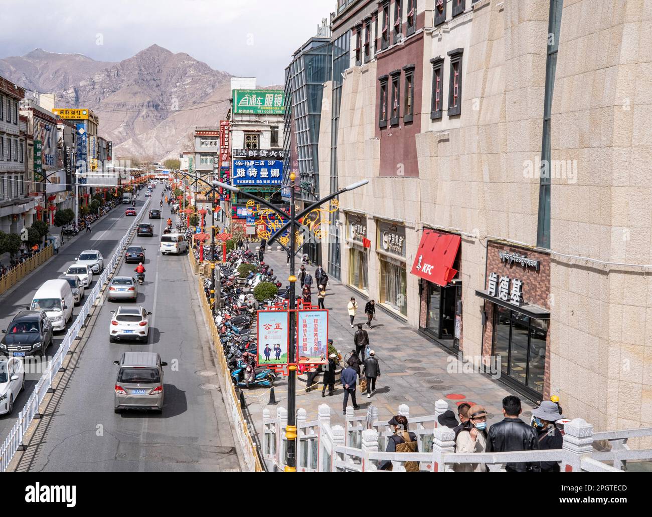 Lhasa, China's Tibet Autonomous Region. 24th Mar, 2023. A KFC branch is pictured on a downtown street of Lhasa, southwest China's Tibet Autonomous Region, March 24, 2023. TO GO WITH 'Letter from Lhasa: A taste of globalization on 'roof of the world'' Credit: Sun Fei/Xinhua/Alamy Live News Stock Photo