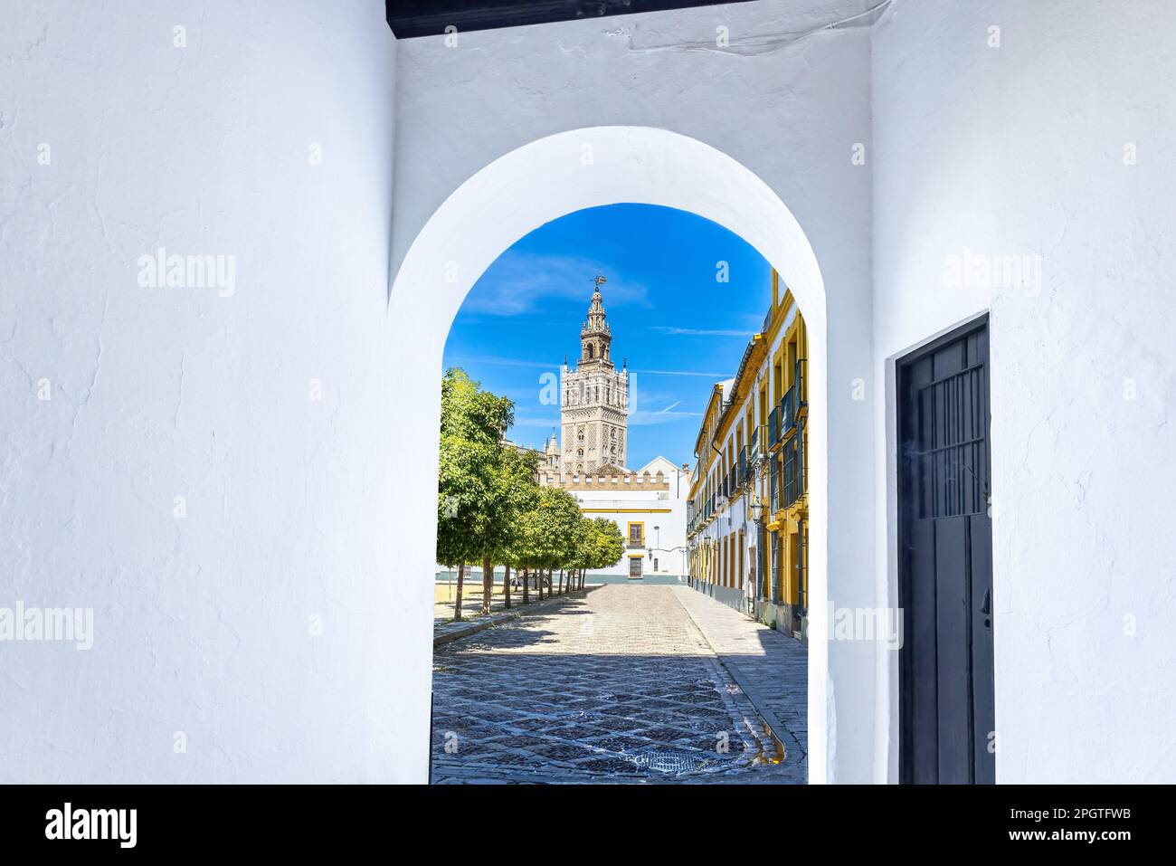 View of tower bell of Seville Cathedral from Santa Cruz neighborhood, in Seville old city center, Andalusia, Spain Stock Photo