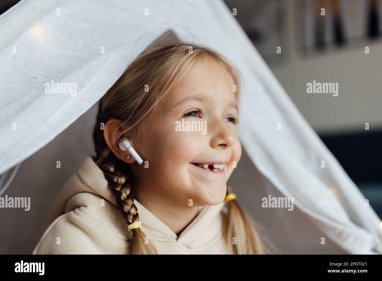 Candid lifestyle portrait of cute little caucasian girl with blonde