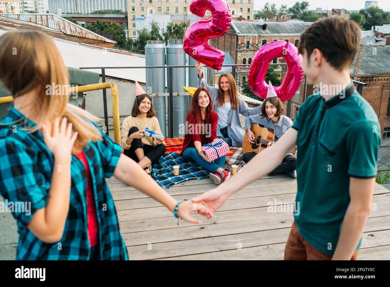 birthday surprise rooftop party friends invite Stock Photo