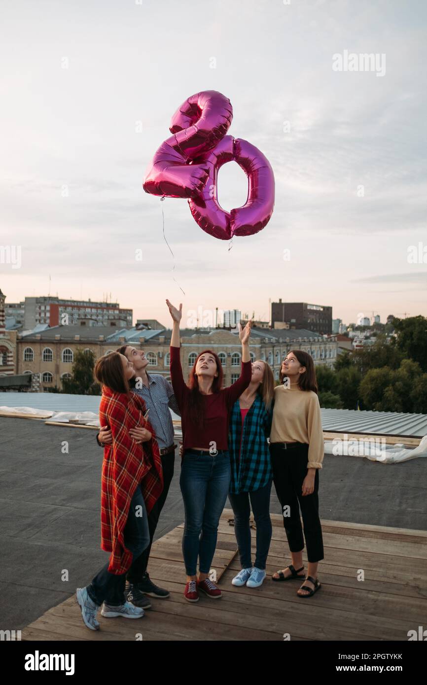 youth 20 birthday rooftop party freedom balloons Stock Photo