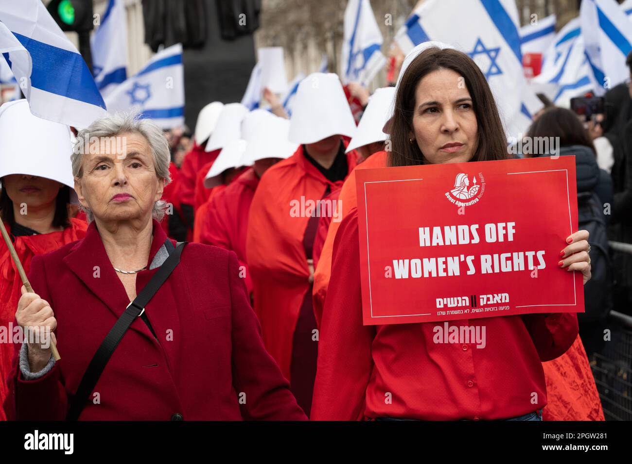 Women dressed as characters from the Handmaid's Tale protest in Whitehall against Israeli Prime Minister Benjamin Netanyahu as he visits London to mee Stock Photo