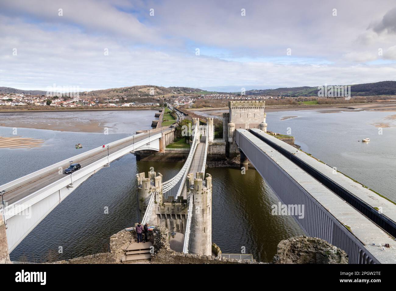 Road, rail and suspension bridges over the river Conwy, Conway, North Wales coast Stock Photo