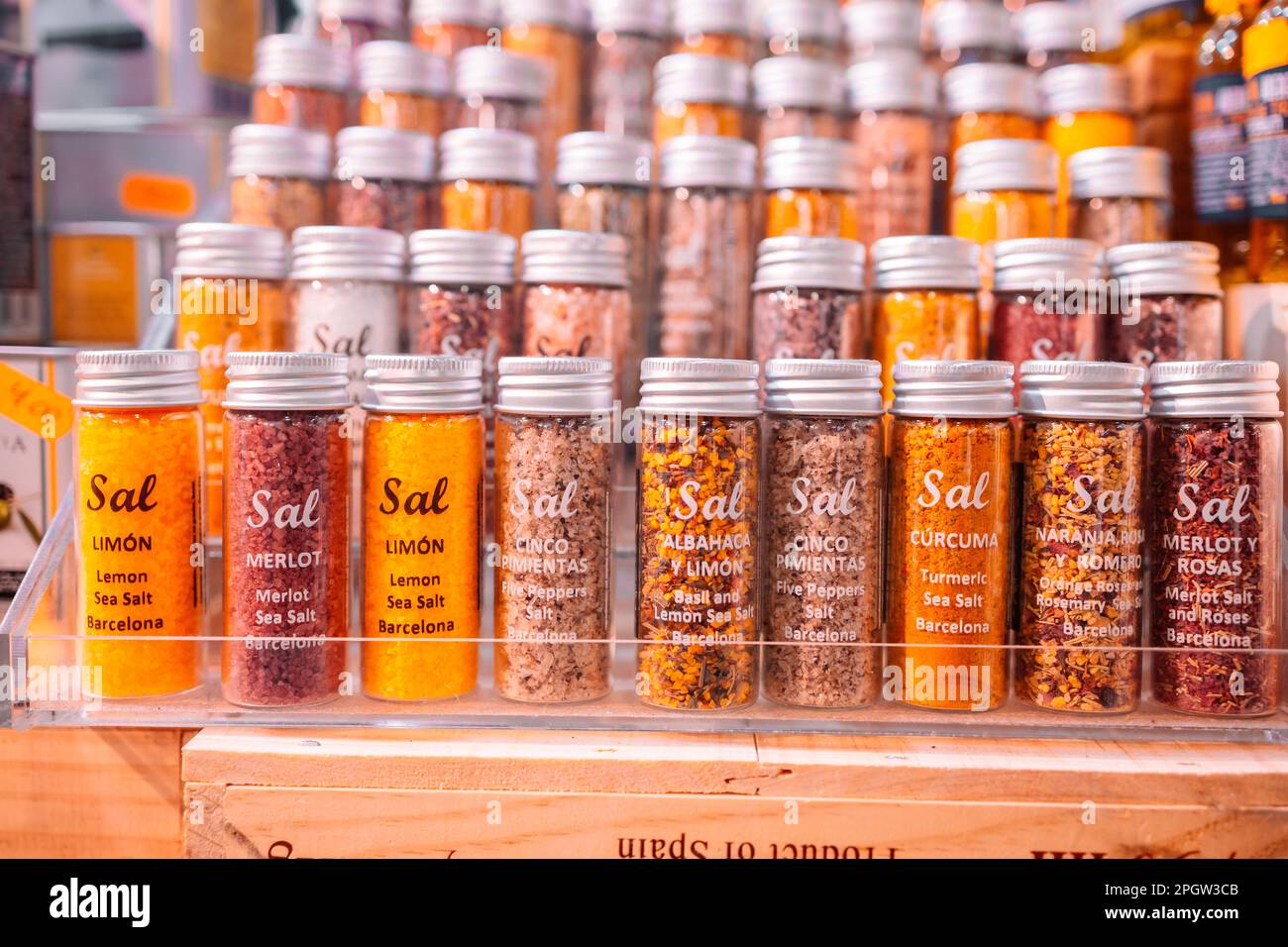 Lemon salt (sal de limon), chili and orange salt (sal de chili naranja) and herbal salt in glass jars at the street market for sale Stock Photo