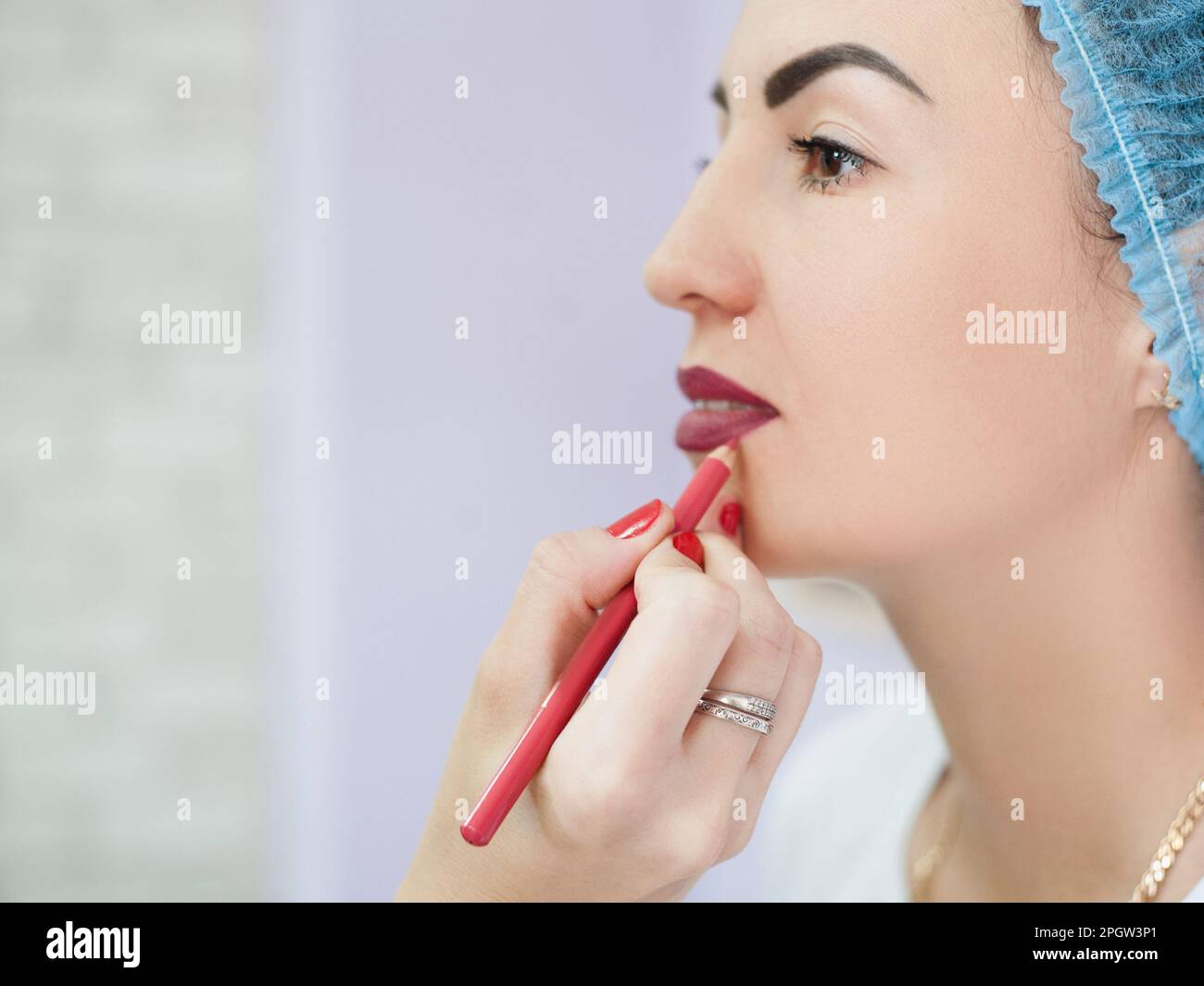 permanent makeup burgundy pencil contour lips Stock Photo Alamy