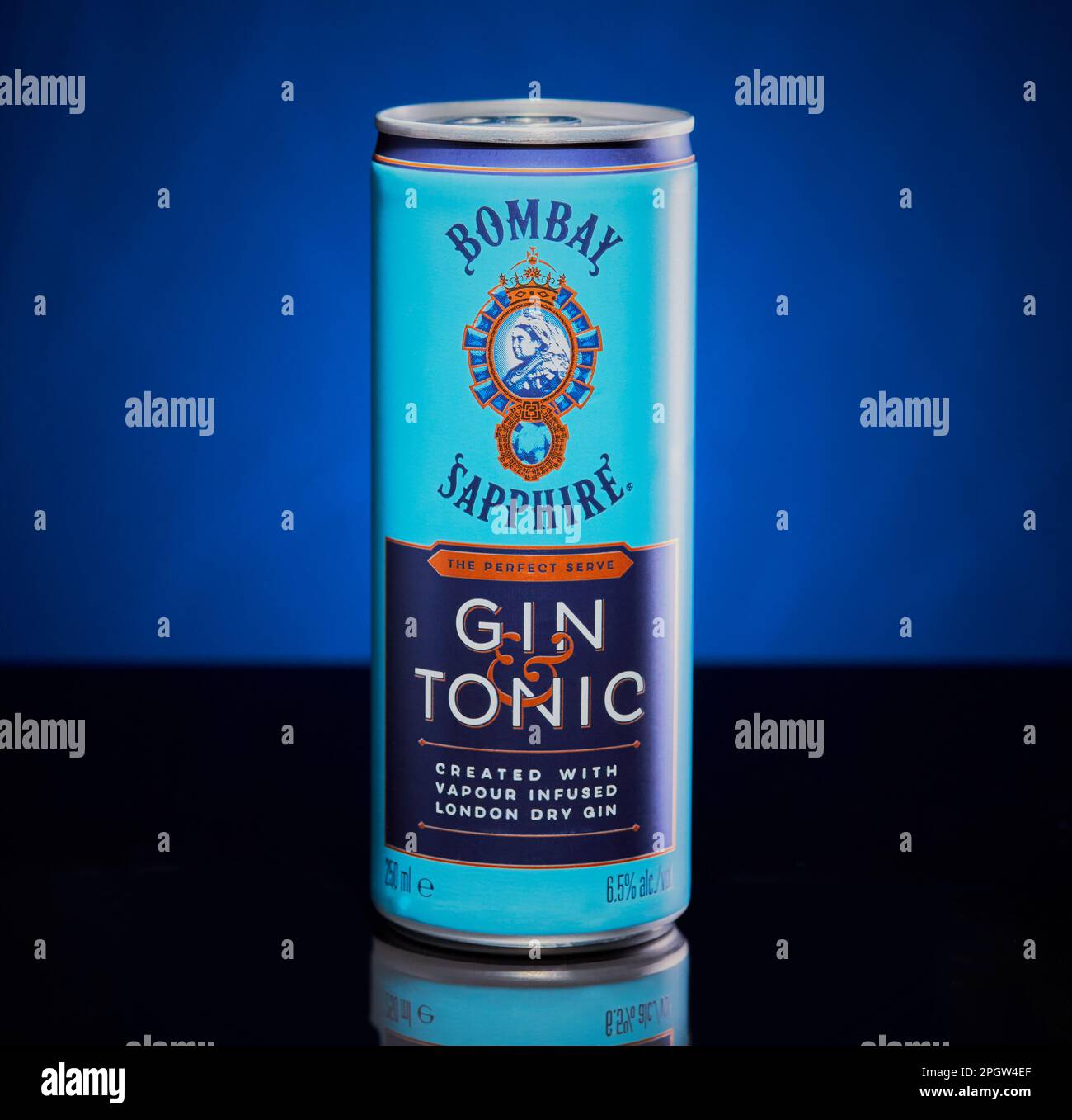 A can of Bombay Sapphire gin and tonic isolated on a blue background